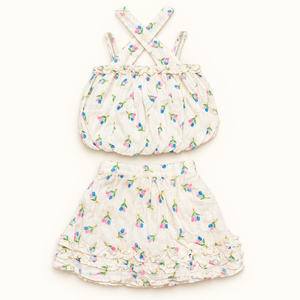 Ivory floral crossed-strap bubble top and matching ruffled skirt
