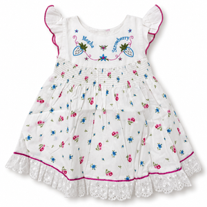 White floral baby dress with strawberry embroidery, shirred waist and lace hem, front view