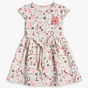 Front view of off-white alphabet and flower print girls dress with waist tie and pink LOVE applique