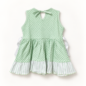 Back of green polka-dot dress with keyhole ties and striped hem