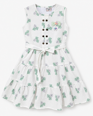 Studio front view of Inaabia white and mint green floral tiered girls dress