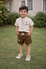 Boy wearing a beige short-sleeve shirt and brown cargo shorts two-piece set
