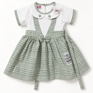 White and sage green checked baby dress with collar and waist bow, front view