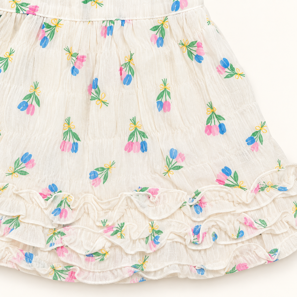 Pink and blue floral print and layered ruffles on ivory skirt