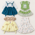 Inaabia 4-piece combo flat lay with teal floral dress, green bunny set, sage lemon party dress and ivory bunny dress