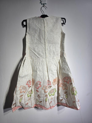 Original front view of Inaabia ivory floral bunny girls dress with pink sash and floral border