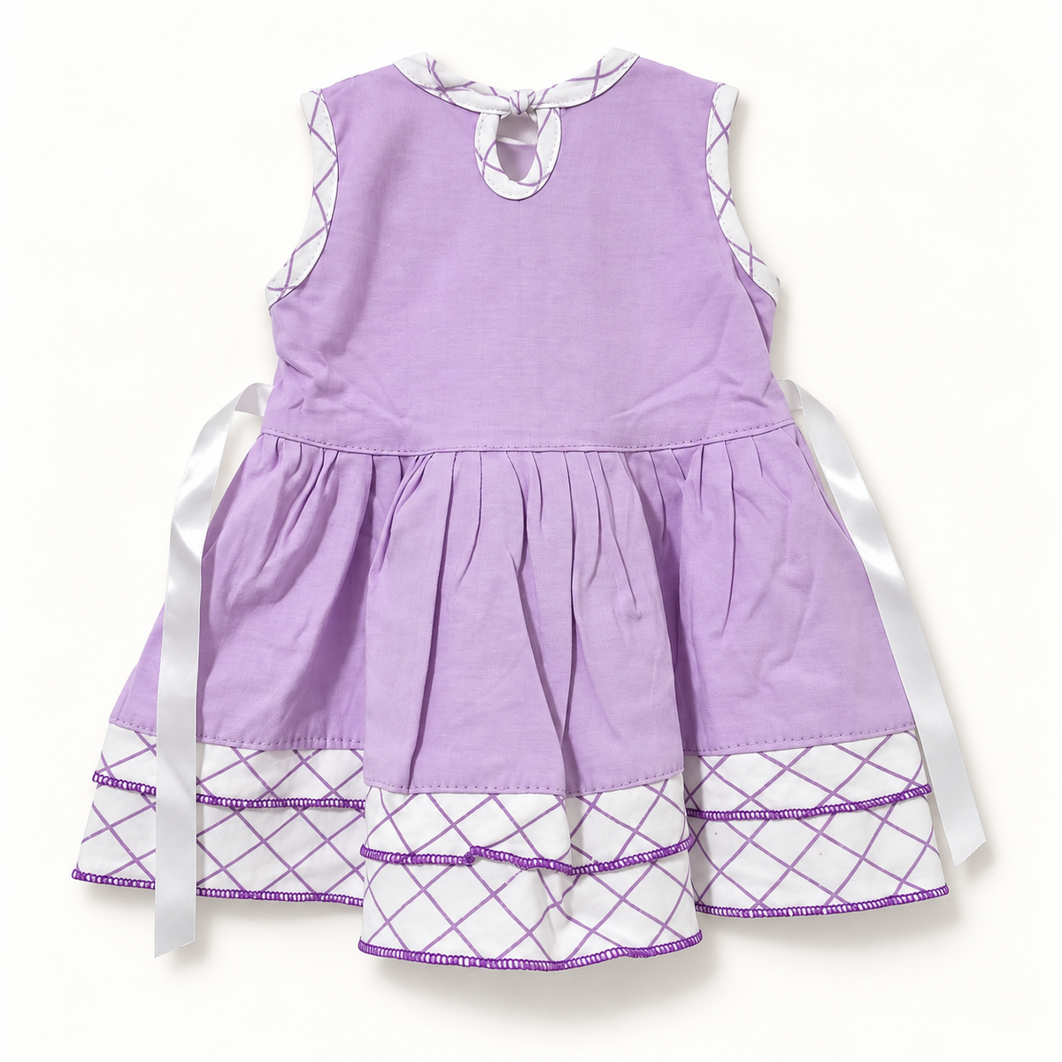 Back of lilac dress with keyhole closure, ribbon ties and lattice hem