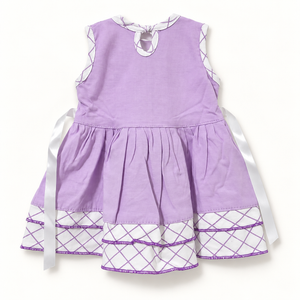 Back of lilac dress with keyhole closure, ribbon ties and lattice hem