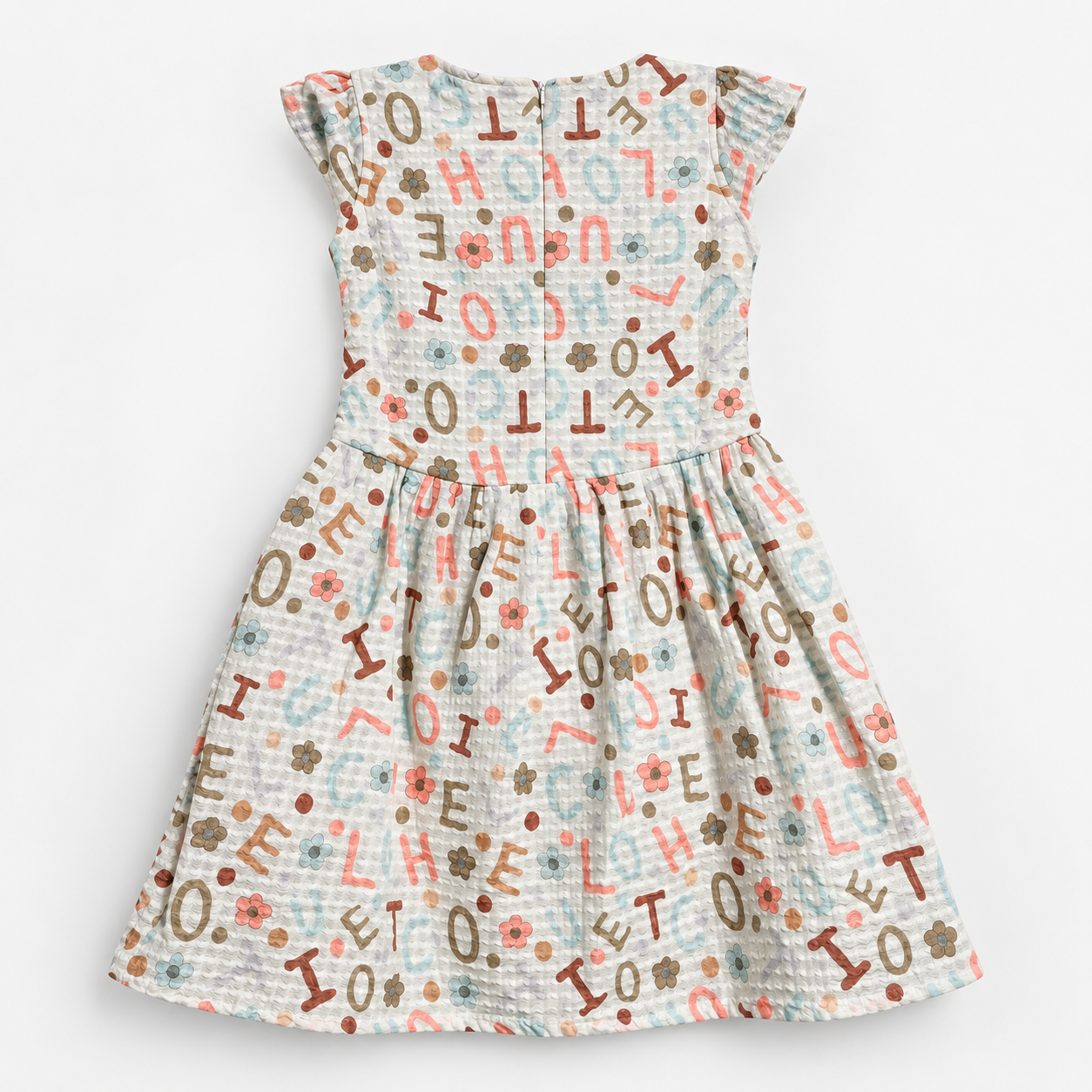 Back view of off-white textured alphabet and floral print girls dress with short cap sleeves and centered zipper